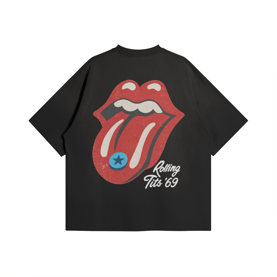 Rolling Tits T-Shirt in Black by Brainrot Dept., back flat lay with red tongue graphic, blue pill and white Rolling Tits script